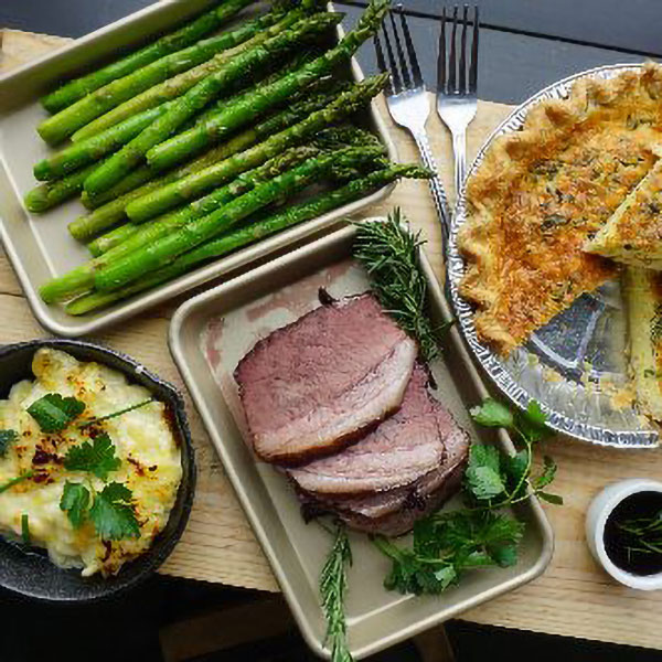 Easter table with ham, quiche, and asparagus