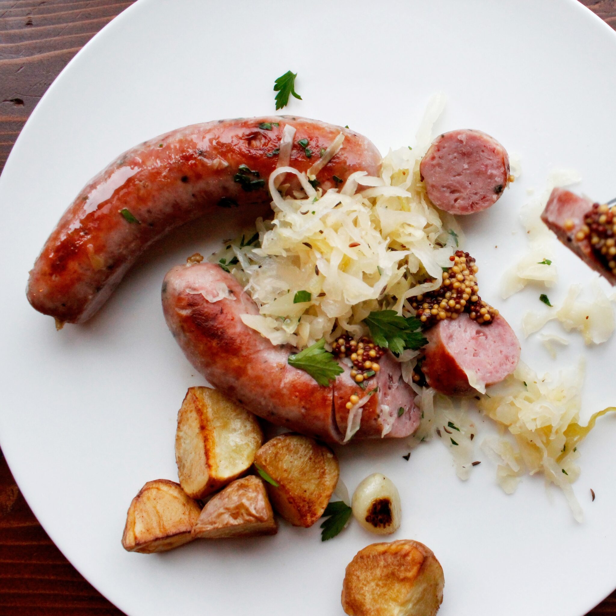 Plate with brats and potatoes